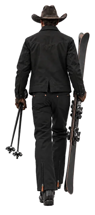 Continue West skier walking away carrying skis and poles